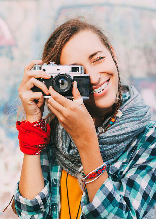 Girl with camera and traditional braces