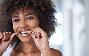 Woman flossing