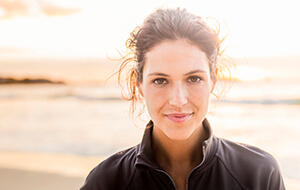 Smiling young woman at beach