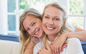 Smiling mother and daughter