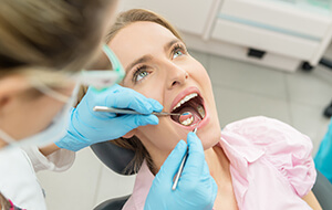 Woman receiving dental exam